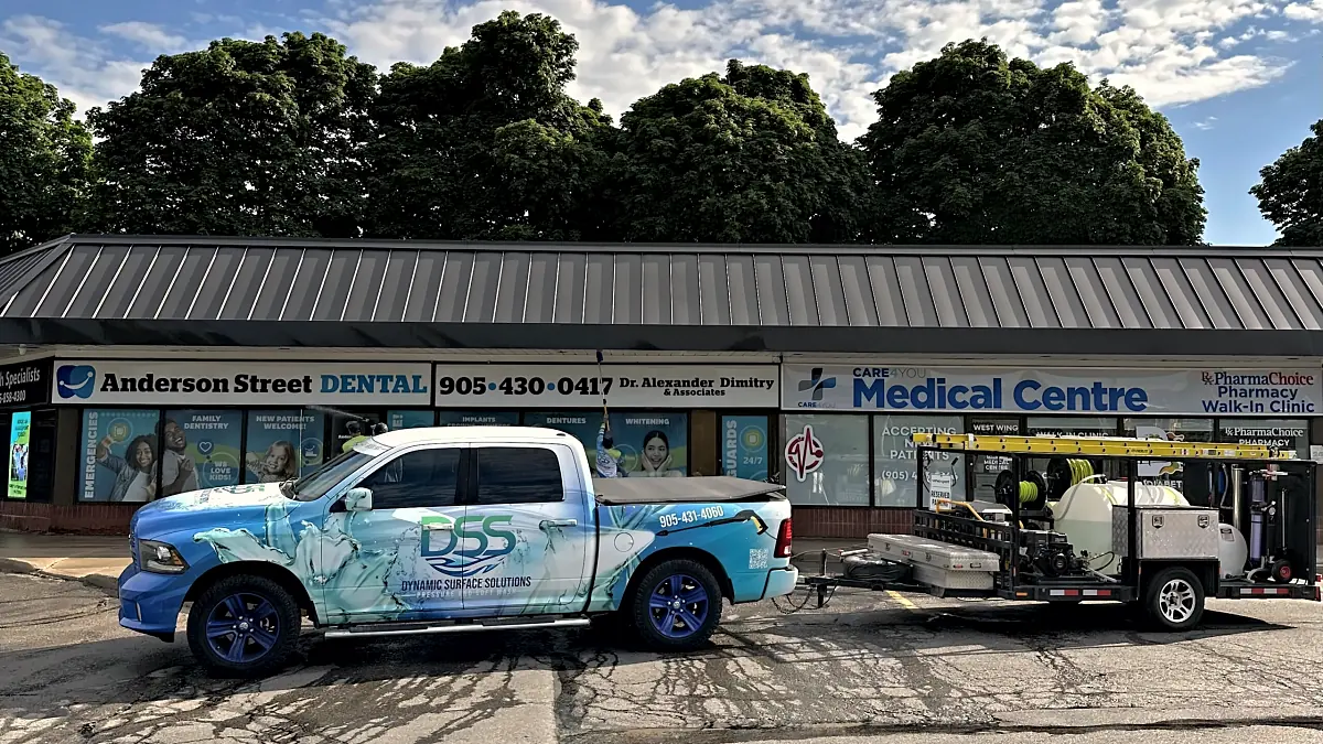 DSS service truck and equipment trailer at a commercial plaza in Whitby
