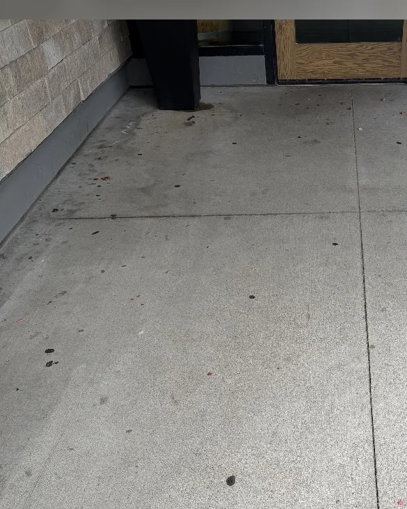 Before: Commercial storefront sidewalk with gum spots and grime at a local restaurant