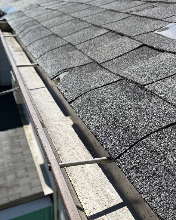 After: The same eavestrough emptied and flushed clean after a clean-out