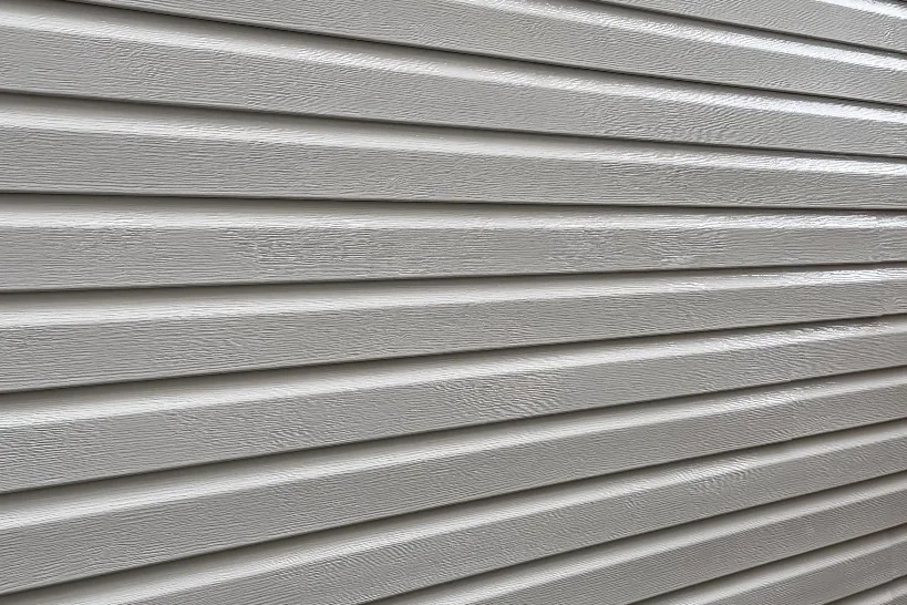 After: The same vinyl siding clean after a low-pressure house soft wash